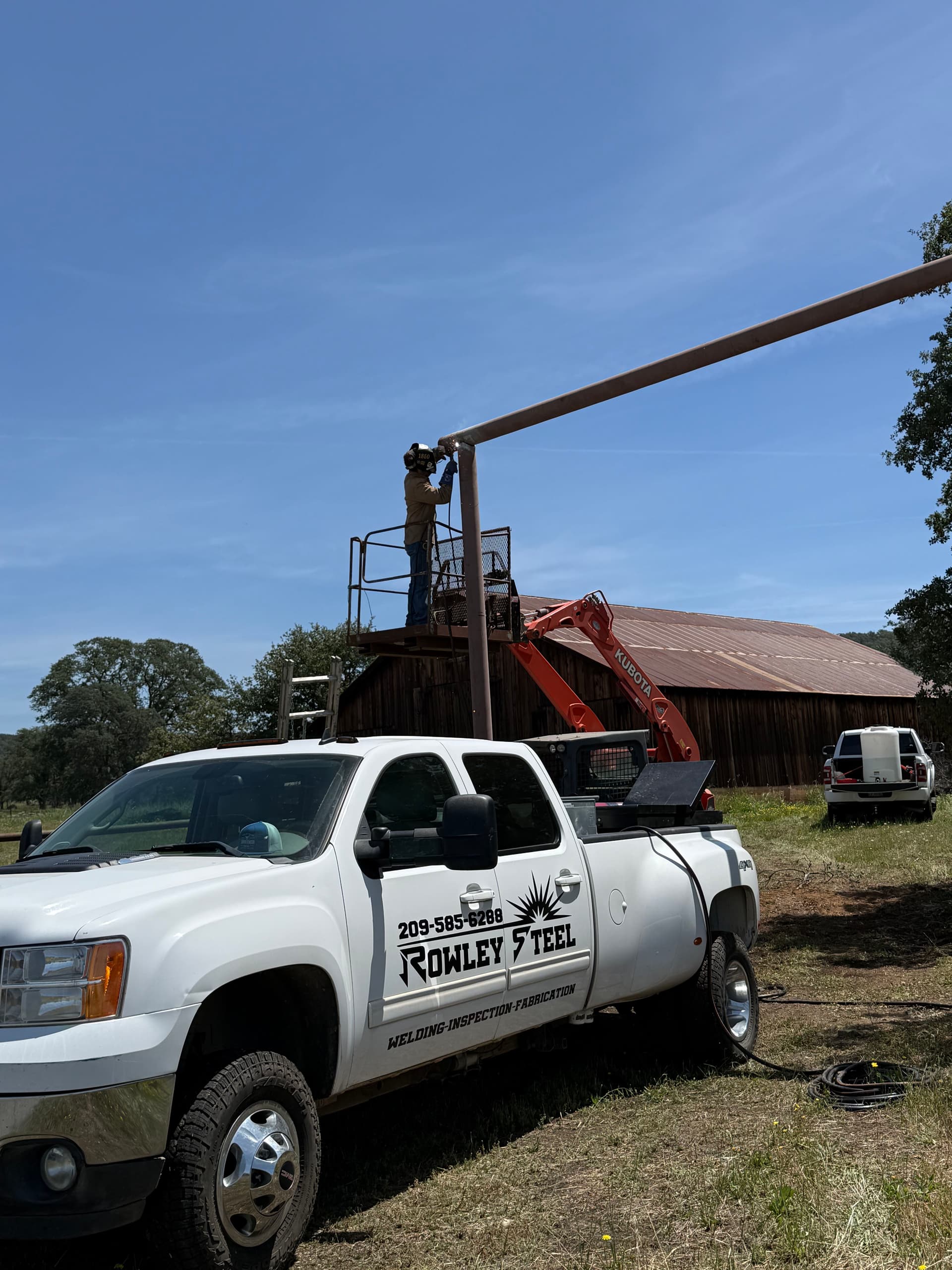 Overhead Steel Gate Frame Welded and Ready Before Fire Season image